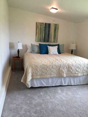 G & Z bedroom is appointed with a king size bed