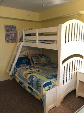 Bunk bed with full bed on the bottom and twin bed on the top.