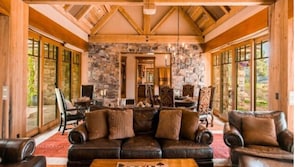 Living & Dining Area w/ trestle wood ceilings from salt mines in Utah. 