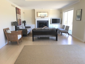 open living room den area with TV and stereo and built-in sound system