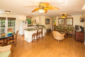 The living area has A/C, a flat screen TV, DVD/CD player, and comfy seating.