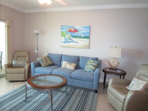 Living room and access to the balcony/ view of the beach