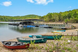 Our private resort dock has boat slips, free fishing poles, kayaks, & canoes