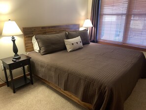 Master bedroom with king bed, side tables with USB connections