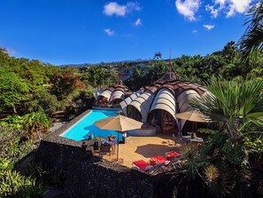 Aerial view of the main house and adjacent master bedroom area.