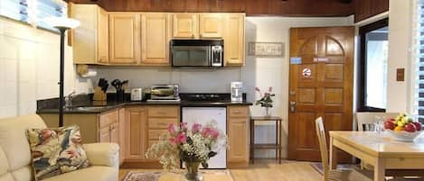 Full kitchenette with sink, disposal, microwave, toaster oven and hot plate.