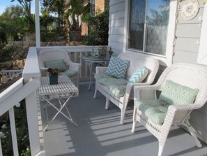 Front balcony porch with easy access to front door, to enjoy morning coffee.

