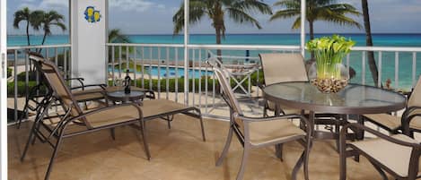 Our balcony has a stunning view of the Caribbean Sea and Seven Mile Beach