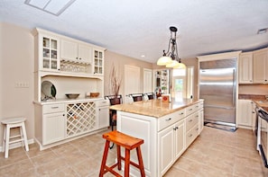 Kitchen has stainless steel appliances and plenty of counter space.