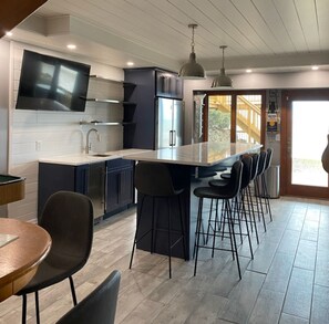 modern games room and Bar that walks out to the water