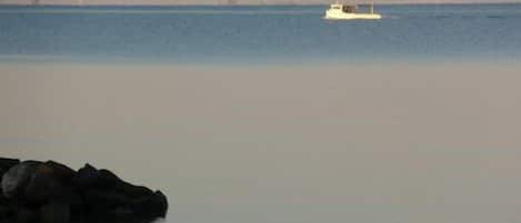 Early morning  crabbing with Bay Bridge 12 miles away over the water.