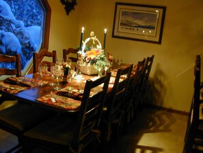 Dining table seats 8-10 with leaves extended.  Breakfast bar seats another three