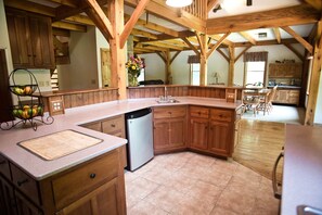 Kitchen showing additional dining area in great room