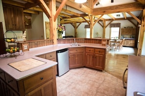 Kitchen showing additional dining area in great room