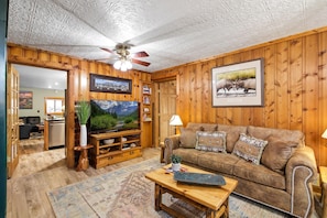 Living Room - Big Screen TV, Desk, Recliner with Ottoman, Soothing River Sounds