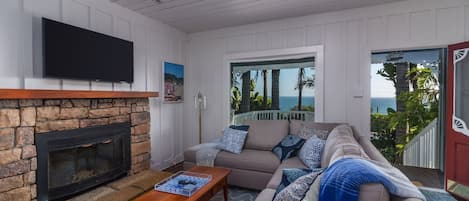 Cozy Living room with flat-screen TV and ocean views.