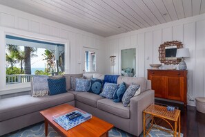 Cozy Living room with large window view of the ocean