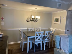Dining area perfect for a family meal or a game of cards!