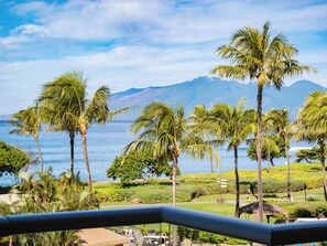 Experience the lush greenery, swaying palms, and endless blue waters of Maui from your private balcony, perfect for relaxation and daydreaming.
