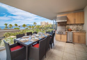 Enjoy outdoor dining on your lanai featuring a fully equipped kitchen and breathtaking ocean views, perfect for family meals or romantic evenings.