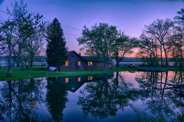 Back view of house across the private cove. Cayuga Lake surrounds on other side