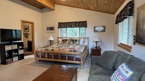 A comfortable and spacious King size bed with an ensuite bath and sitting area