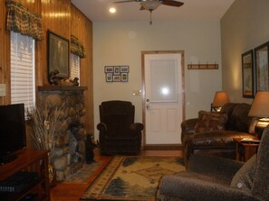 Living Room's romantic ambiance.. Soft light, glowing fire & a glass of wine!