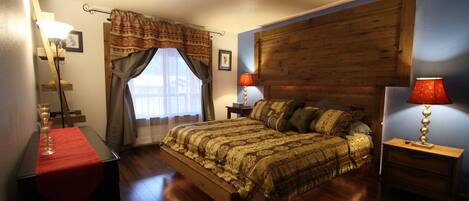 The master bedroom is gracefully designed, featuring a luxurious King bed.