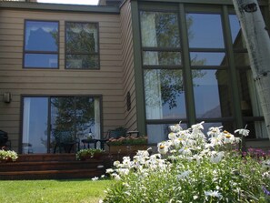 Back of the property with floor to ceiling windows