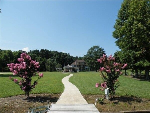 View of the home from the lake, it's closer than it looks