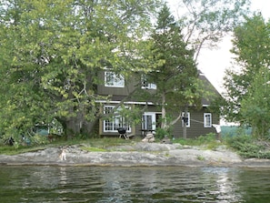 Tucked into the trees, main cottage