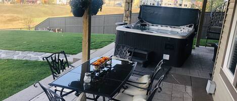 Your patio and hot tub. Protected from the rain.