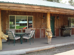 The large front porch is perfect for outdoor meals and relaxing.