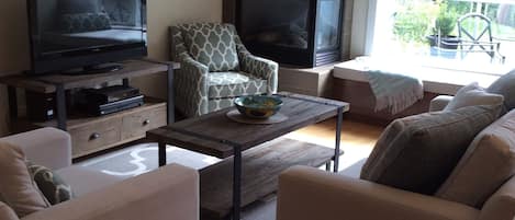 Living room w/ furniture from Urban Barn and window seat cushion for relaxation