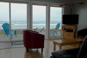 Dory Cove family room view. Kitchen space is to left. Door to full width deck.