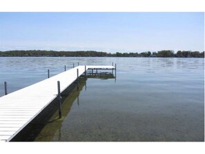 deck with shallow sandy beach and large section for fishing and boat docking