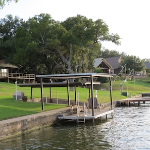 Shaded dock and covered boat lift good for boats up to 5,000 pounds.