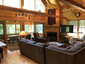 Large living room with attached screened in porch