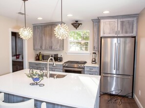 Highest quality furnishings, quartz counter tops, leather bar stools