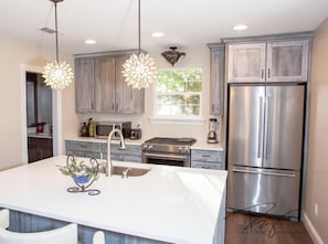 Highest quality furnishings, quartz counter tops, leather bar stools
