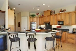 fully equipped kitchen with breakfast bar