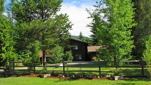 Spacious manicured lawn with ample parking.