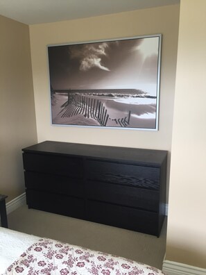 Full size dresser in bedroom.