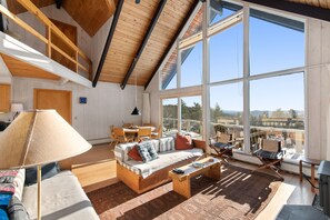 The living room and dining area has great light.
