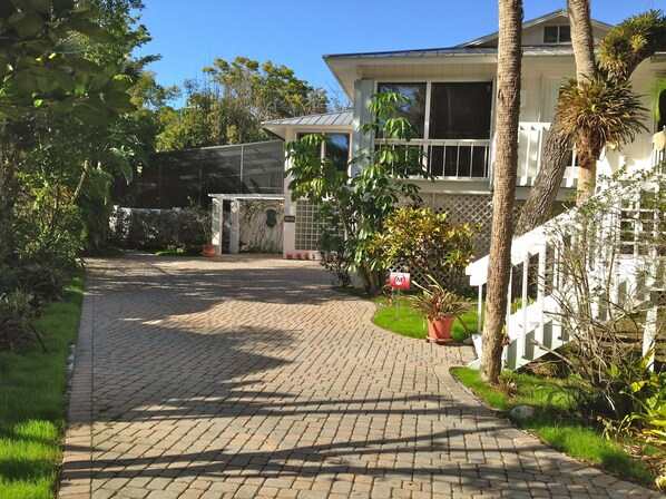 The Tree House front and paver driveway.  Front staircase landing and balcony.