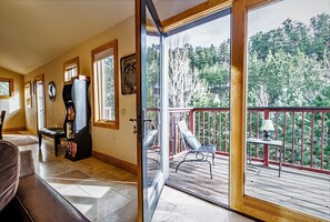 Living room opens out to one of the two decks.  Listen to the river below.