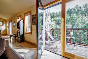 Living room opens out to one of the two decks.  Listen to the river below.