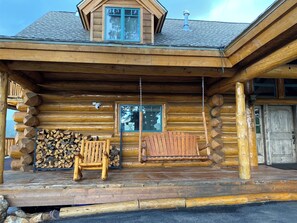 Chair and swing on front porch
