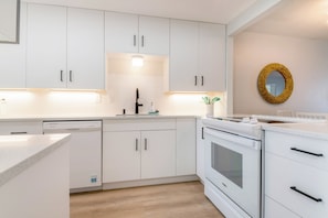 Renovated 2025. Kitchen entrance. Spacious with tons of storage space.