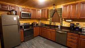 The kitchen has all major appliances, cookware and diningware.